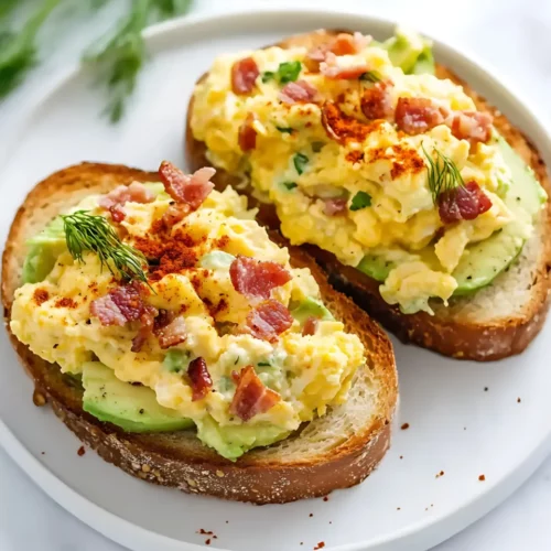 Avocado egg toast with bacon on plate