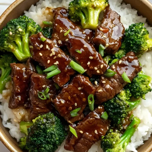 Beef and broccoli over rice in a bowl