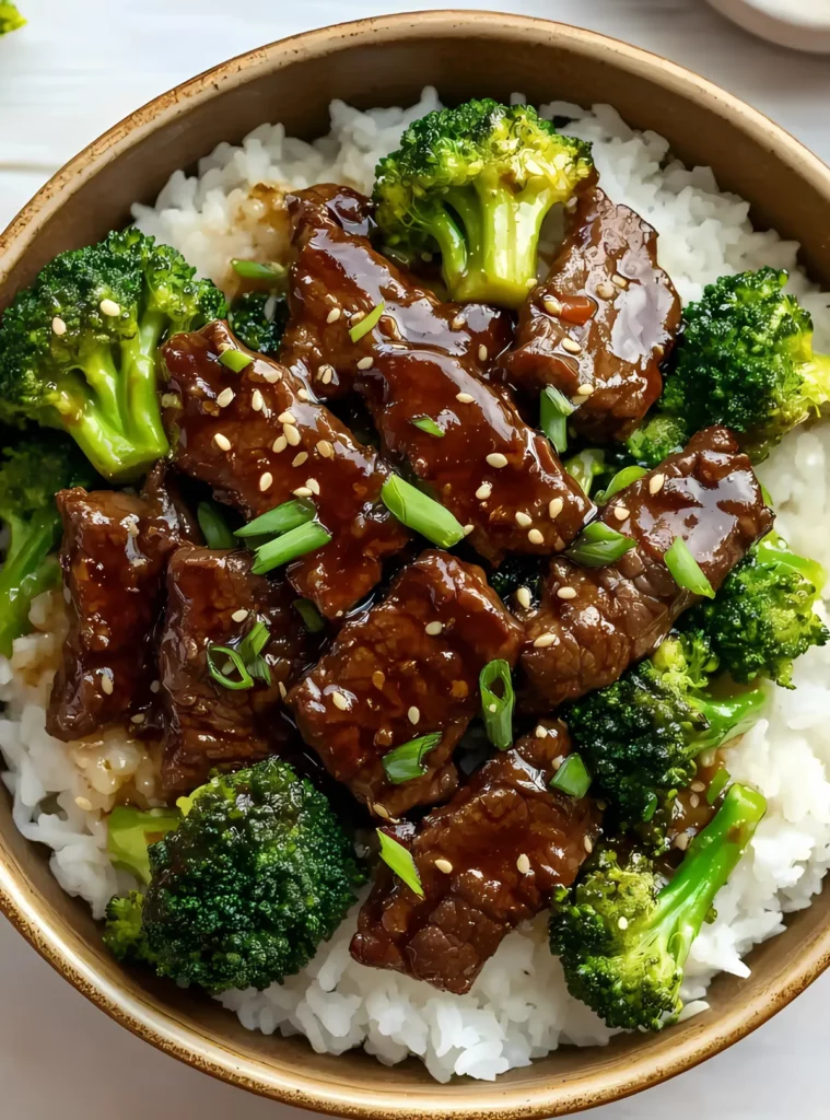Beef and broccoli over rice in a bowl