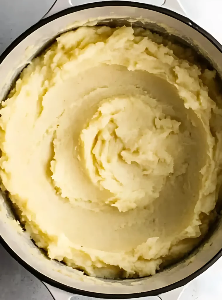 Mashed potatoes in pot on scale