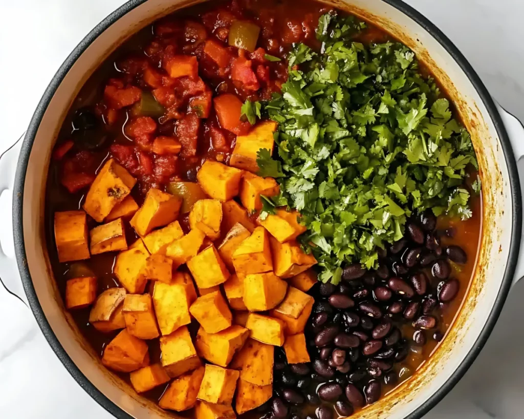 Sweet potato chili with fresh cilantro in pot