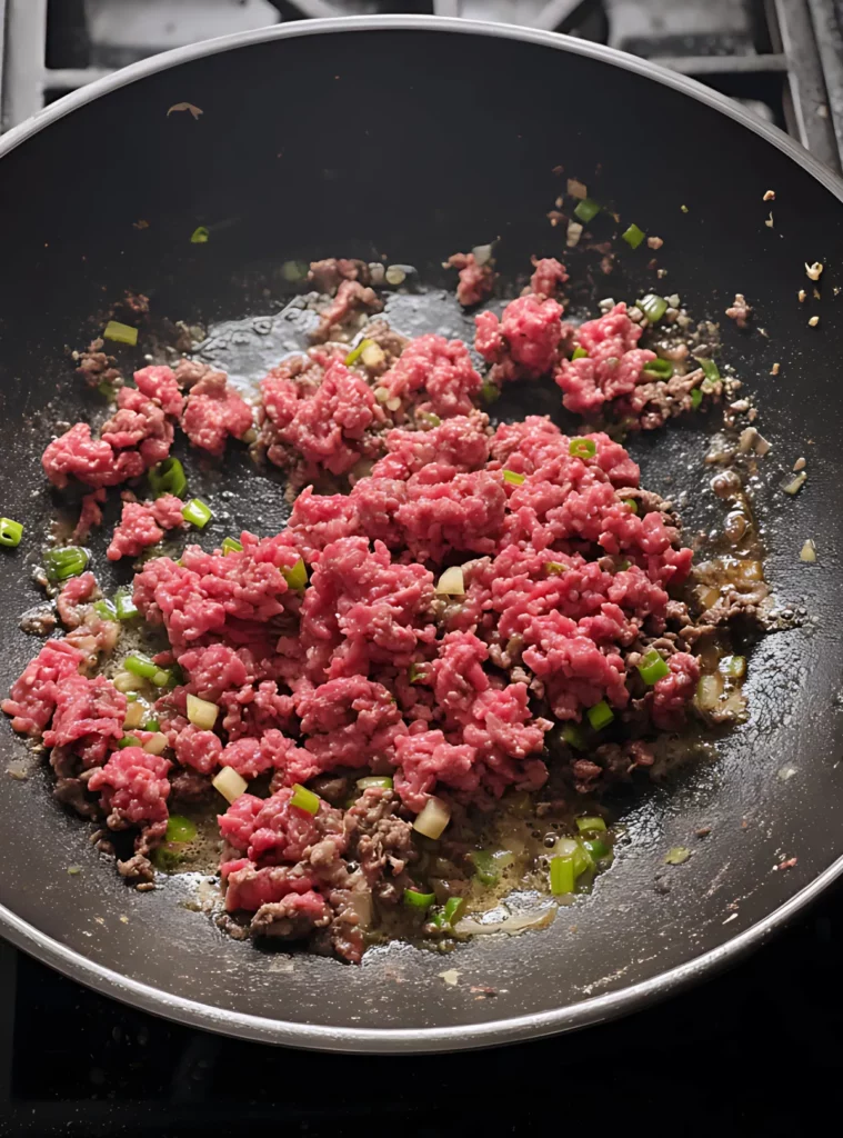 Browning ground beef with scallions