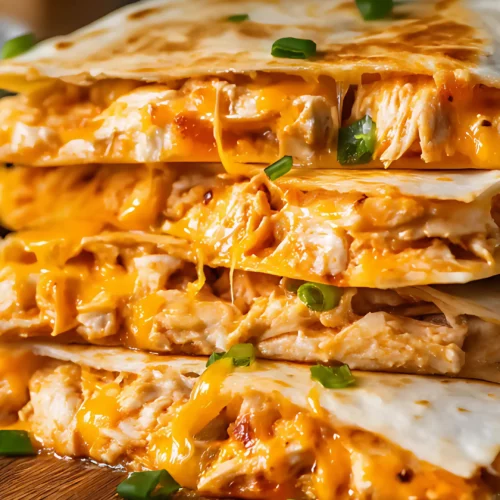 Cheesy buffalo quesadilla stack on cutting board