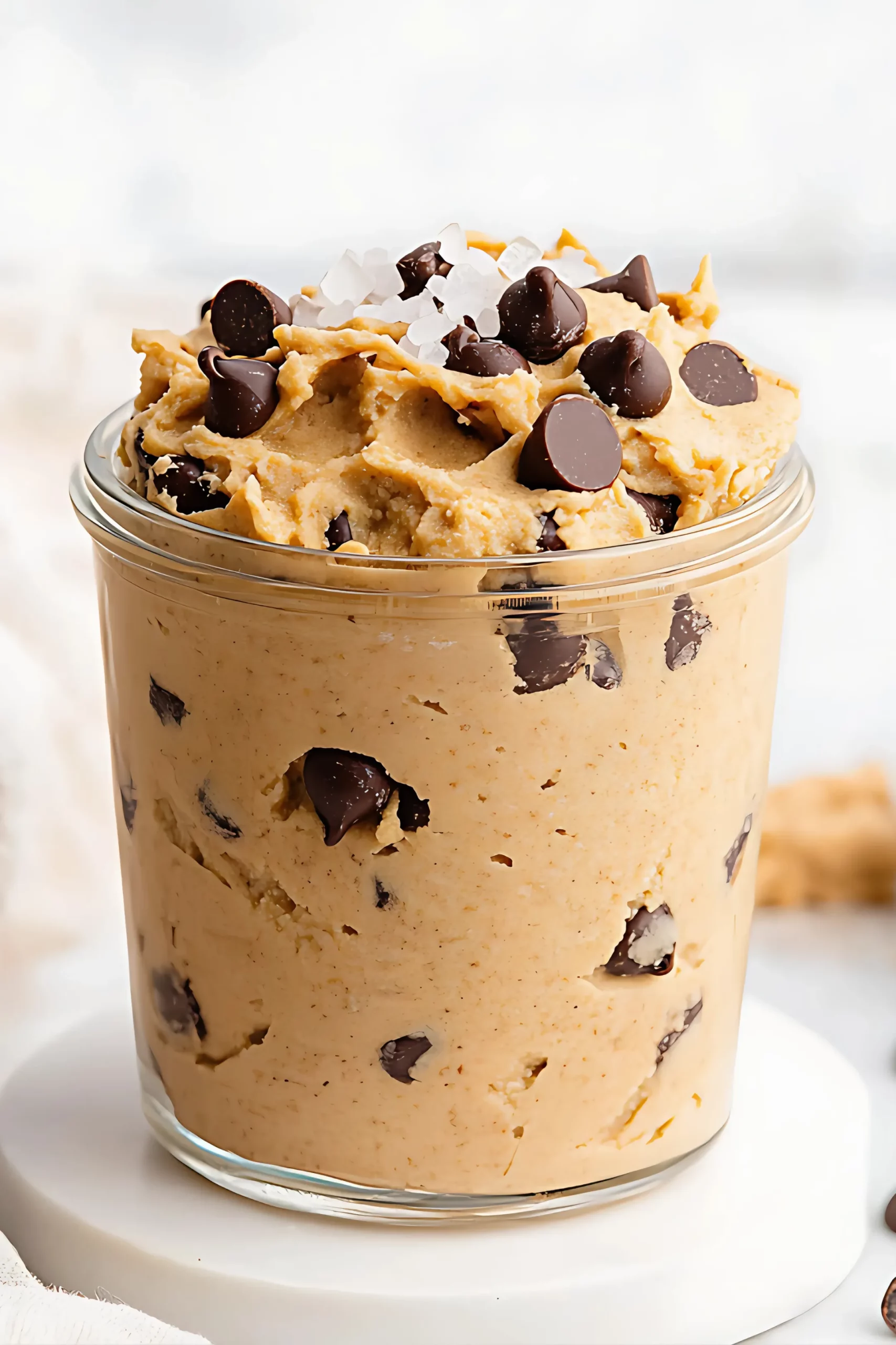 Chocolate chip cookie dough in a glass jar