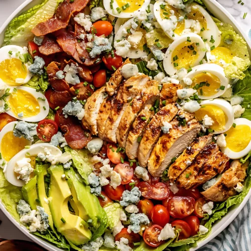 Cobb salad close up with eggs bacon blue cheese and chicken