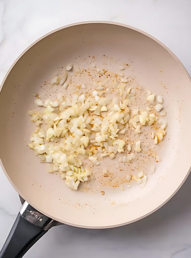 Sautéed chopped onions in skillet