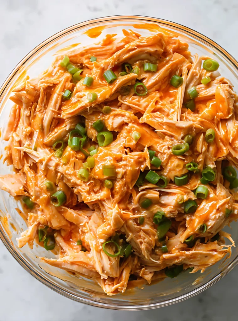 Shredded chicken tossed in buffalo sauce