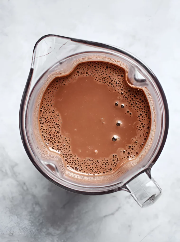 Blended chocolate mousse inside a blender