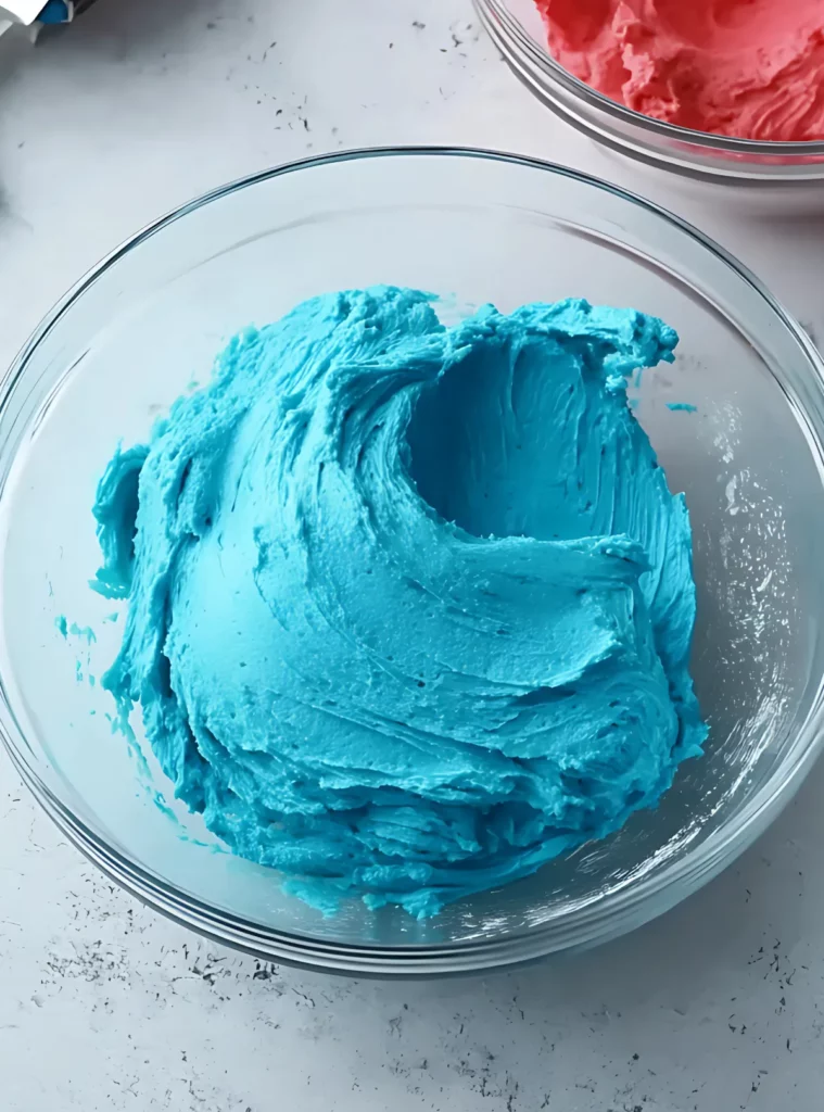 Blue cookie dough in glass bowl