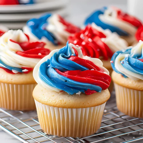 Red white blue cupcakes on cooling rack