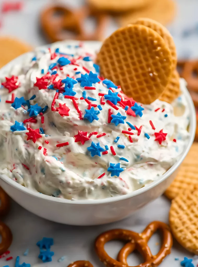 funfetti dip with star sprinkles and two waffle cookies