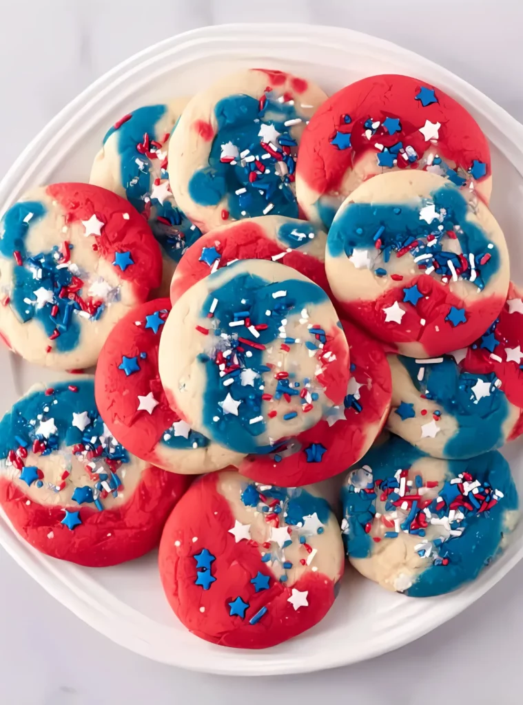 patriotic cookies with sprinkles on white plate