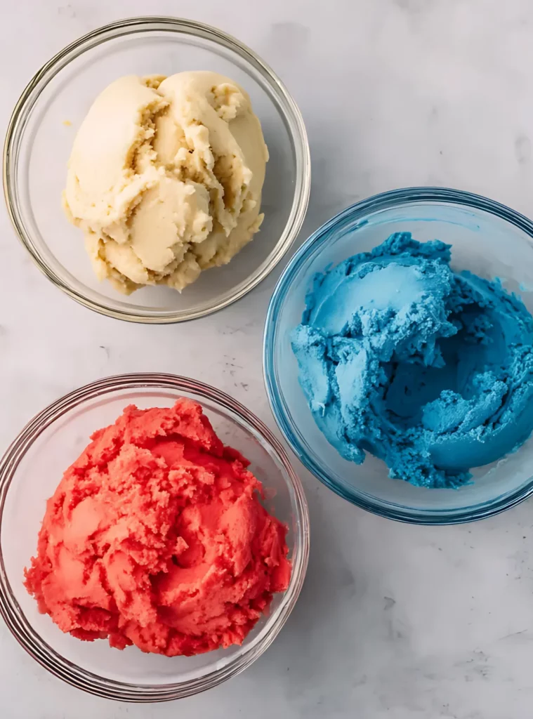three bowls with red white and blue cookie dough
