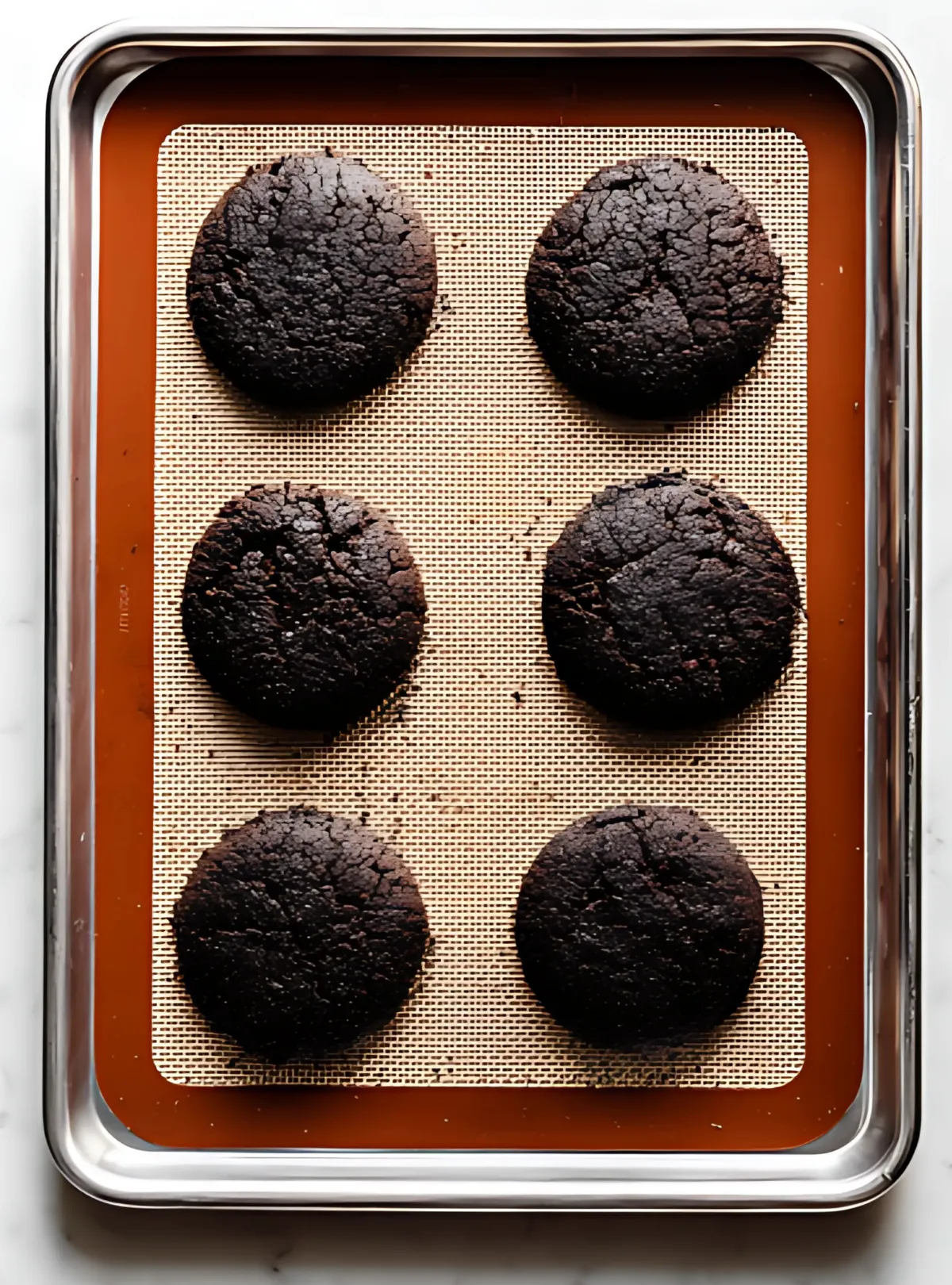 Baked chocolate cookies on baking sheet
