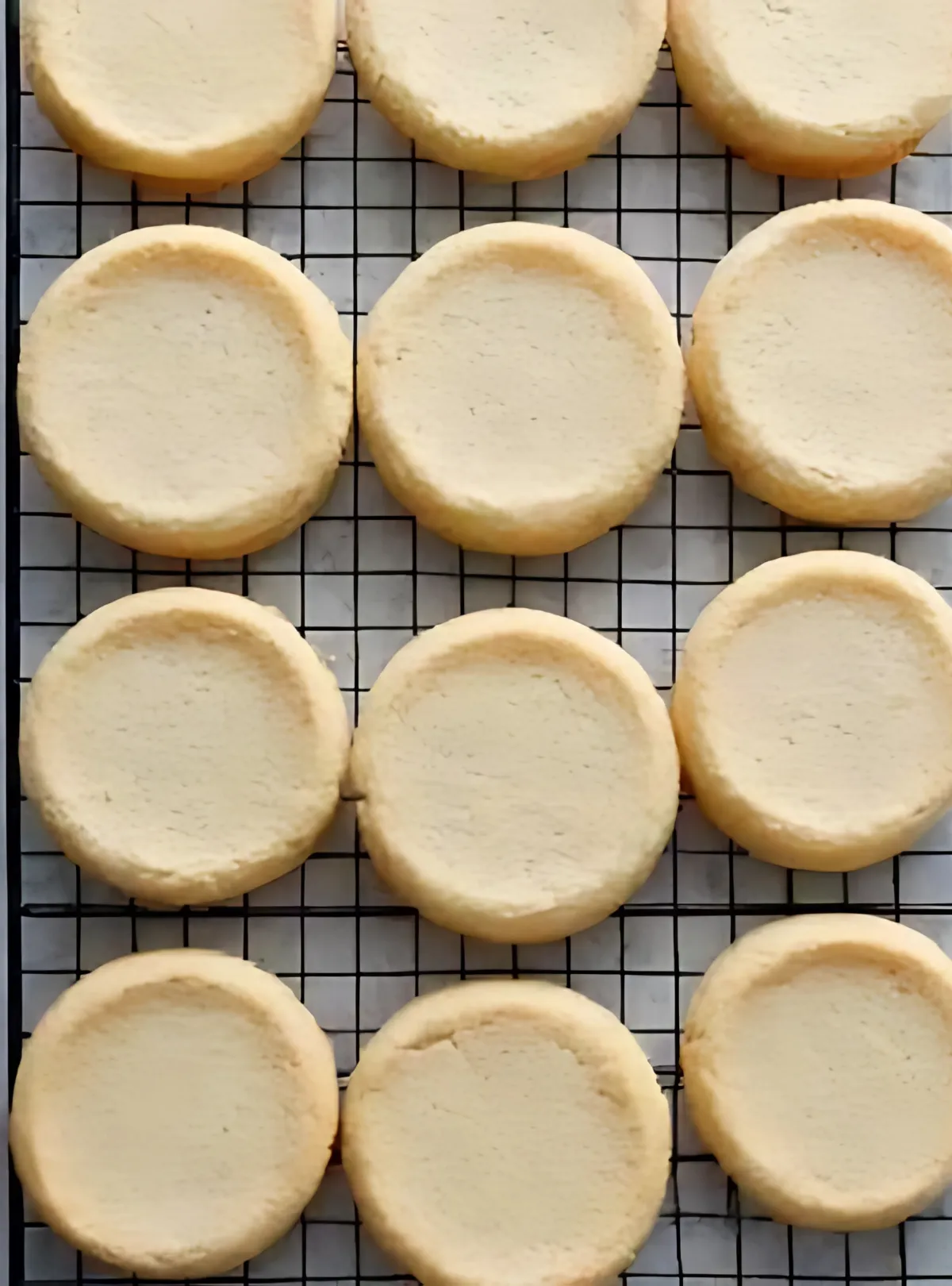 Baked plain sugar cookies on cooling rack