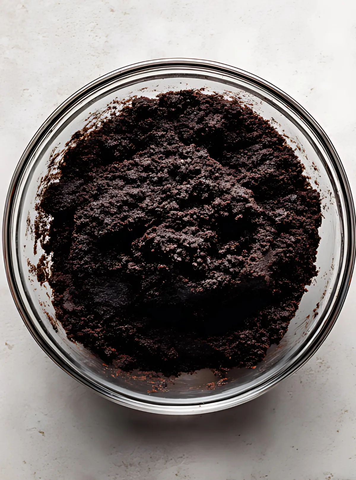 Dark chocolate cookie dough in glass bowl
