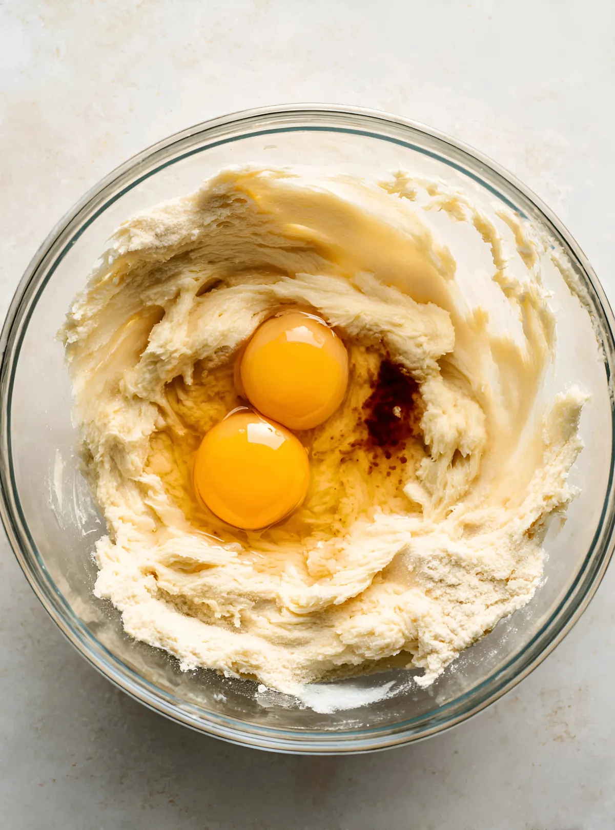 Egg and vanilla in creamed butter mixture