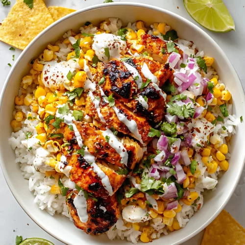 Grilled chicken rice bowl with corn red onion sour cream