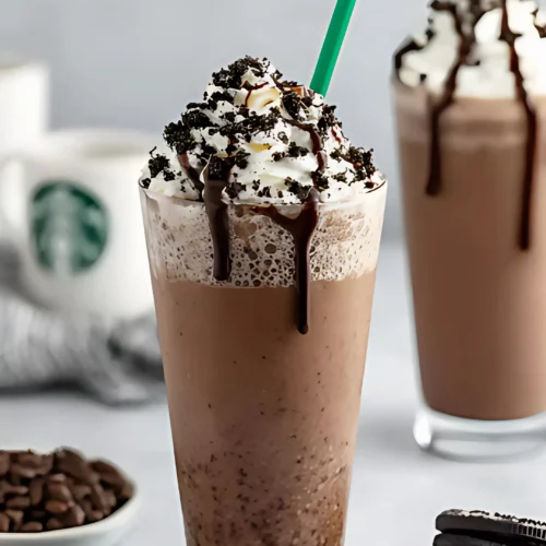 chocolate frappuccino with whipped cream and green straw