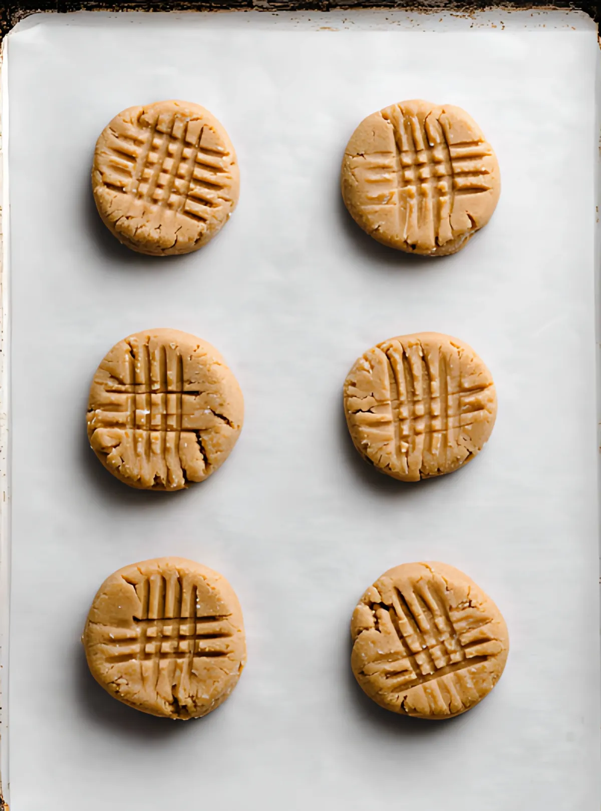 cookie dough discs on baking sheet