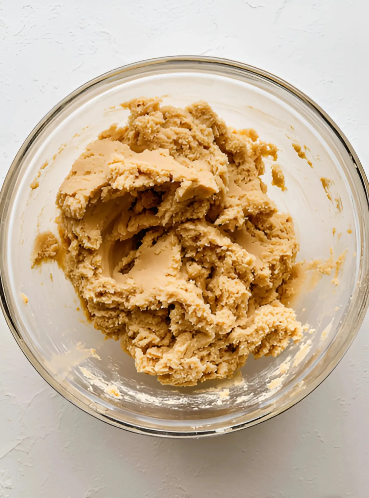 peanut butter cookie dough in glass bowl