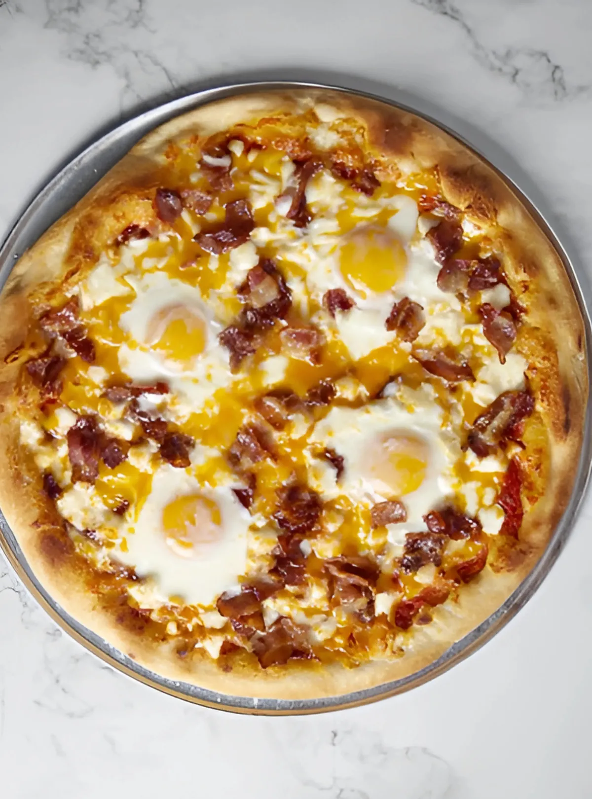 Baked breakfast pizza with melted cheese
