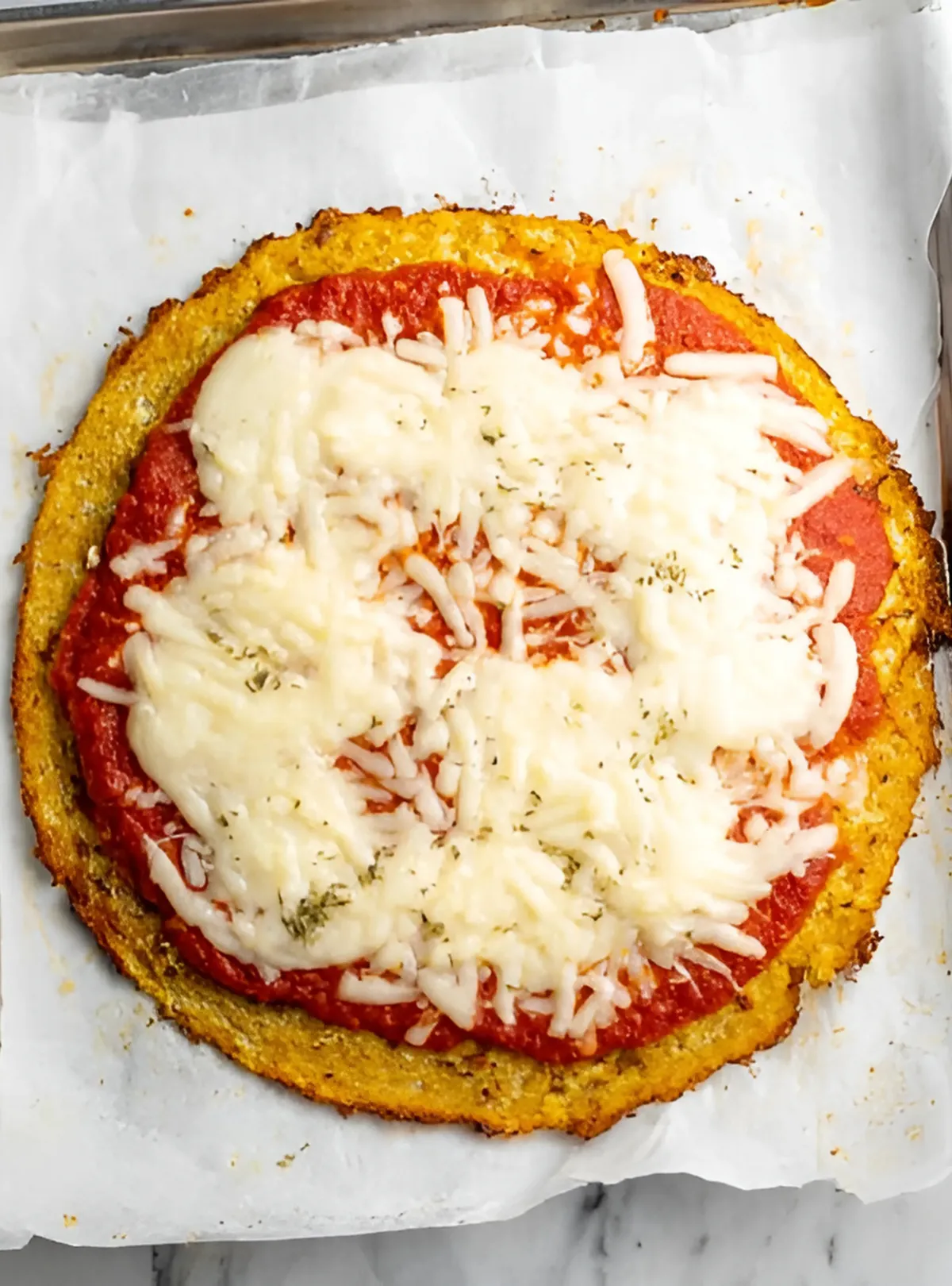 Cauliflower crust pizza with melted cheese