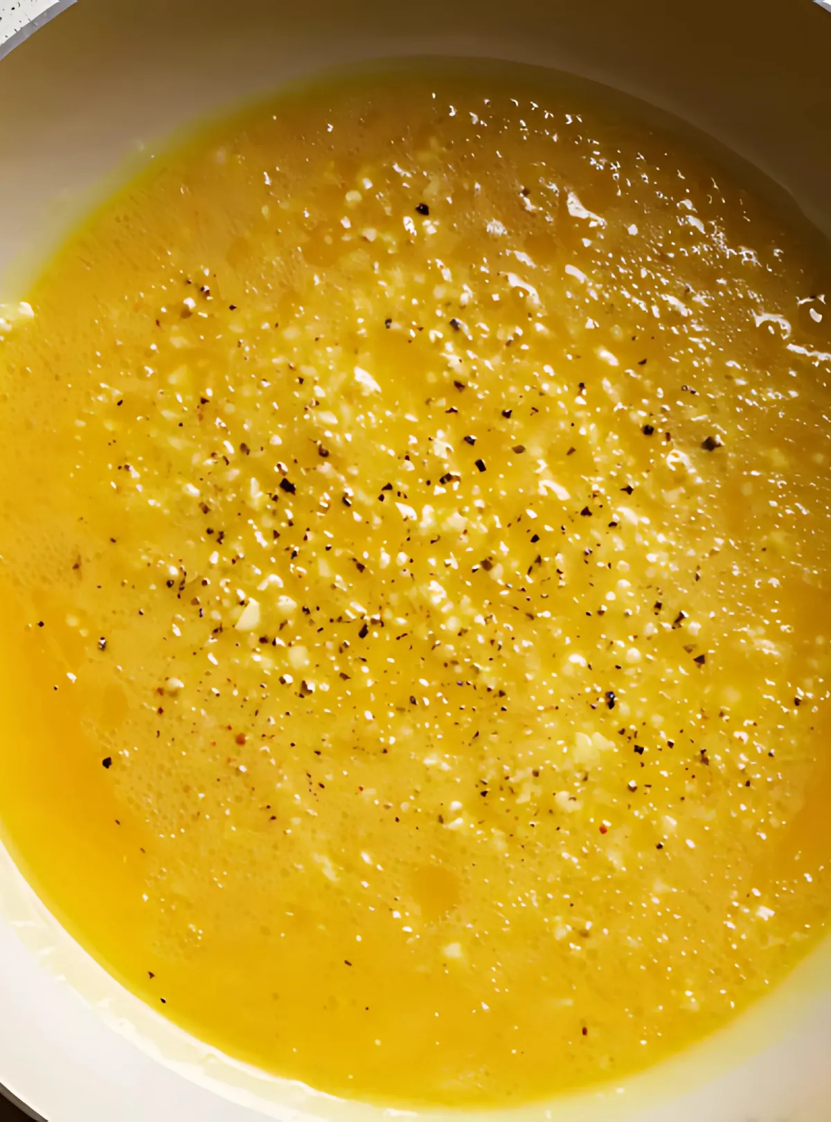 Garlic lemon butter sauce in skillet