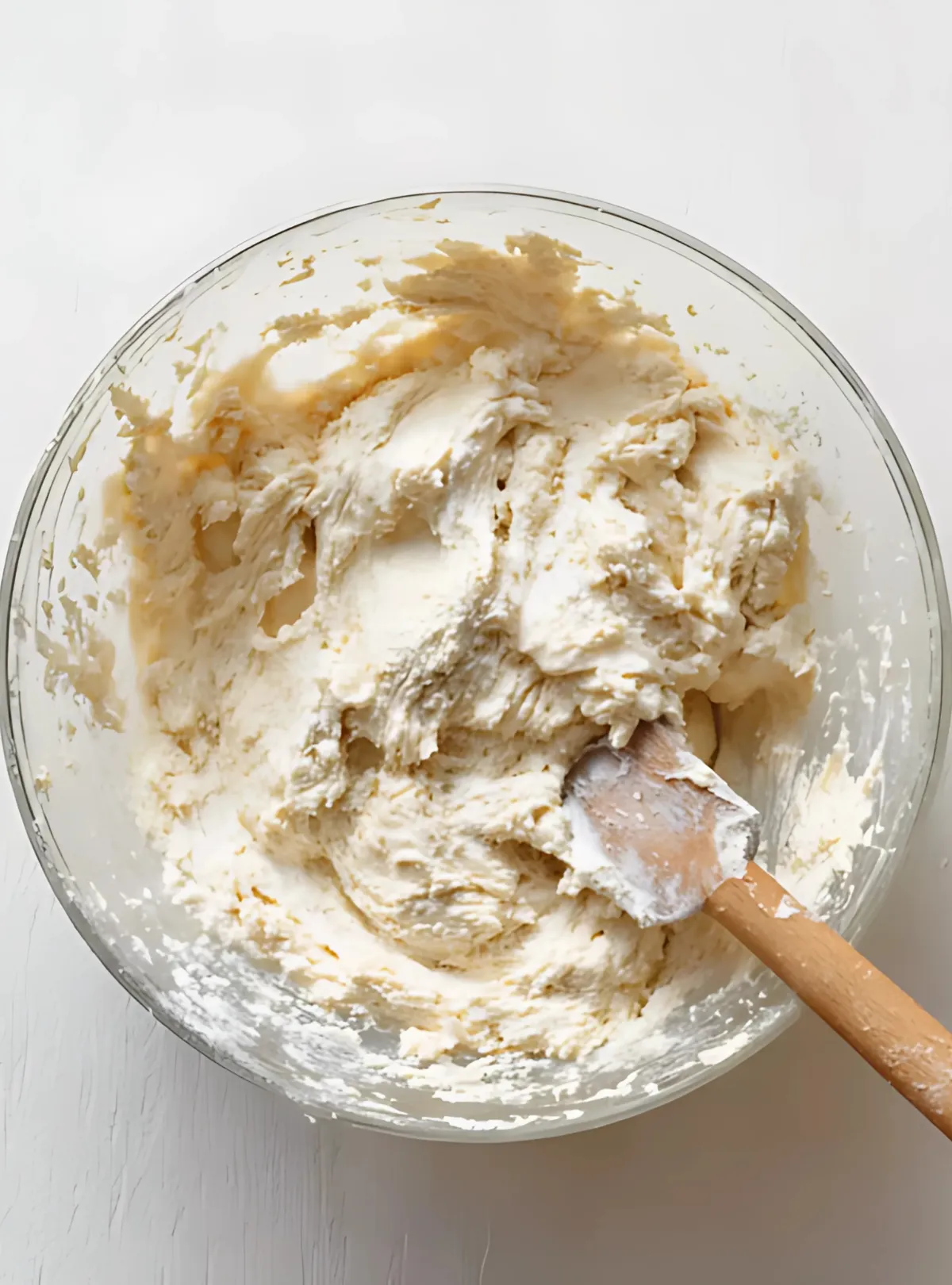 Glass bowl of mixed pizza dough