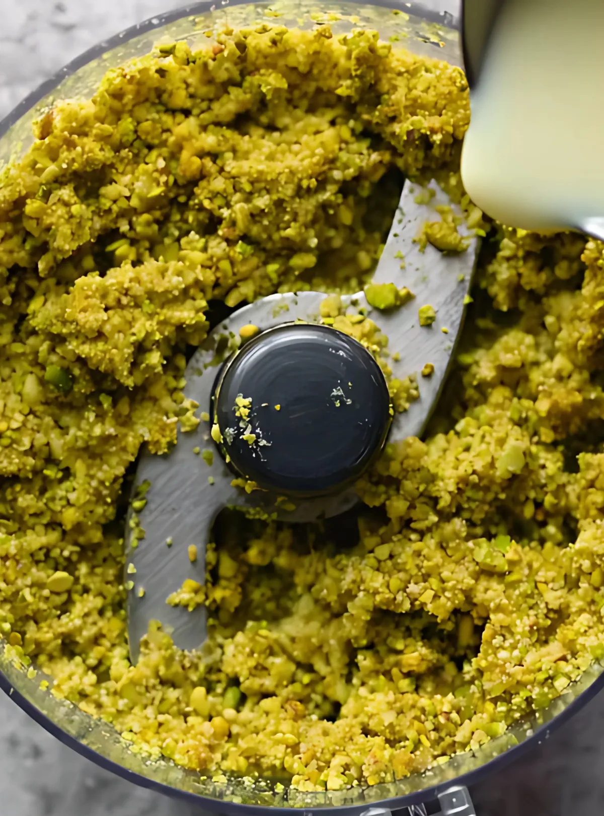 Ground pistachios in processor