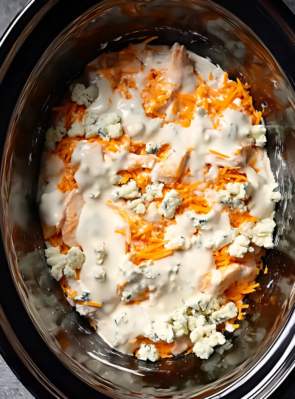 Ranch and cheese over raw chicken in slow cooker