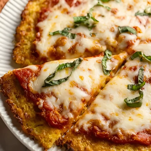 Sliced cauliflower pizza with basil