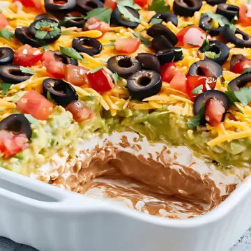 Taco dip with scoop removed side view