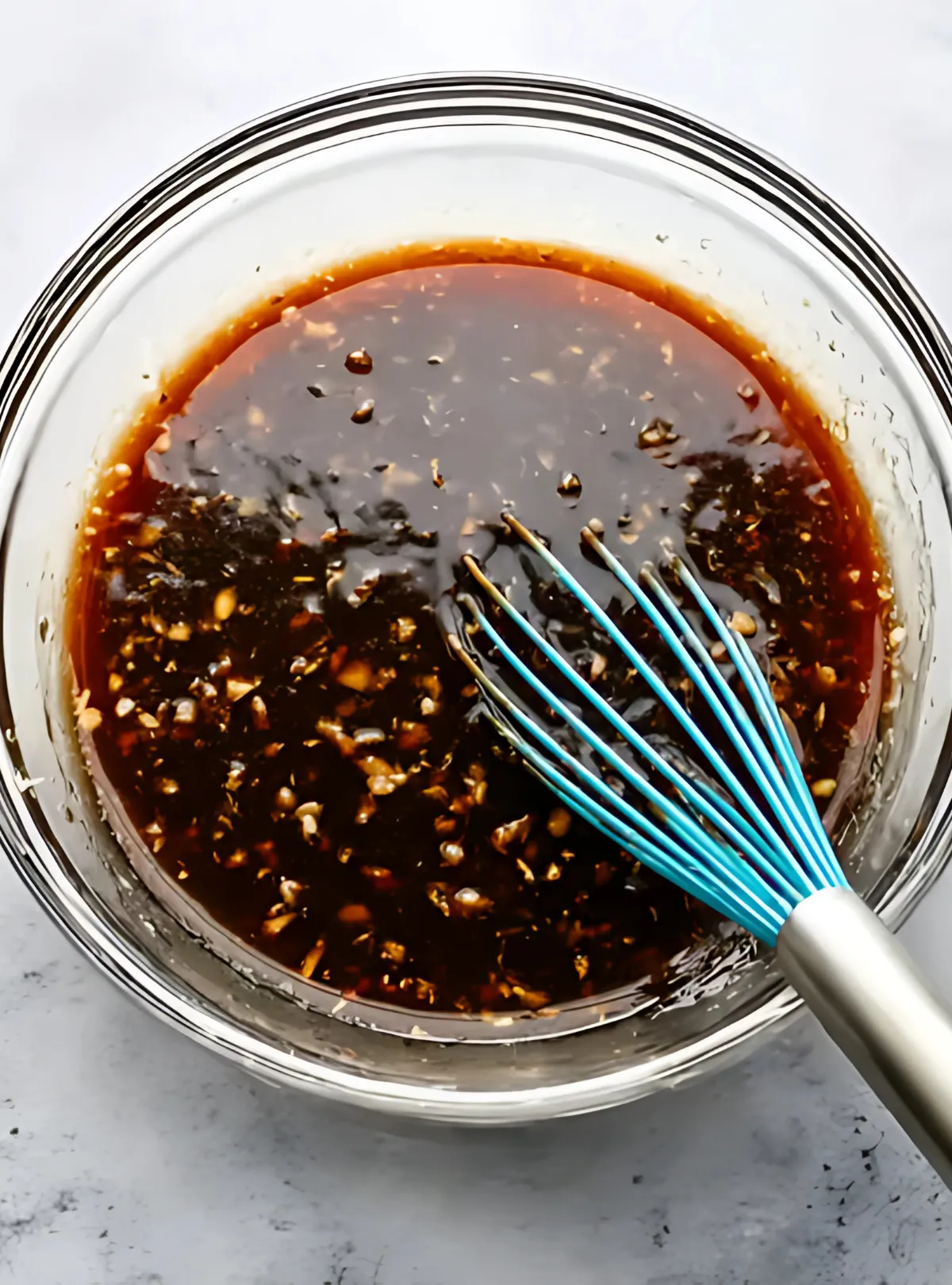 Whisk mixing honey garlic glaze