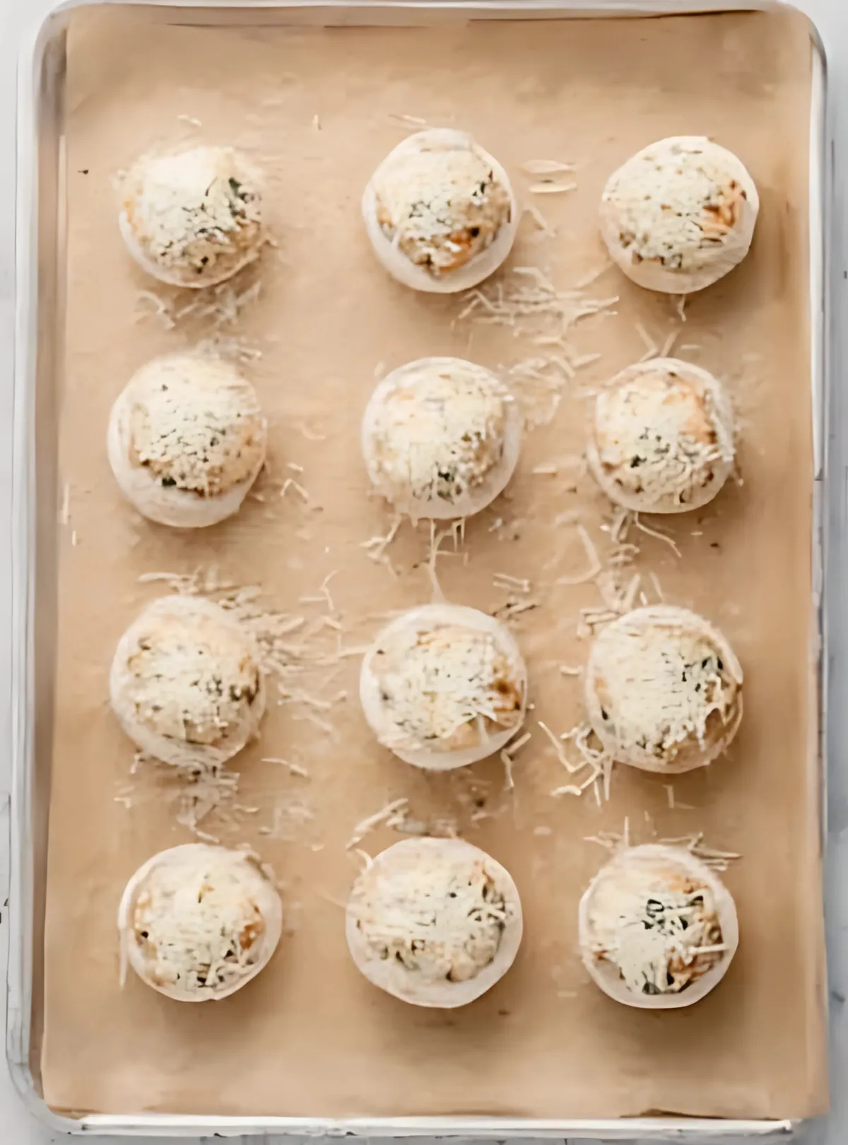 raw stuffed mushrooms on baking tray