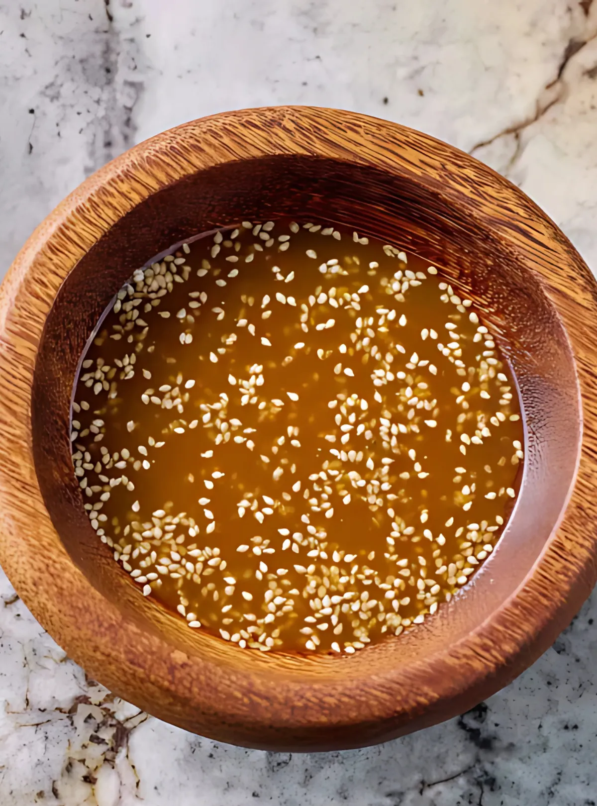 sesame dressing in wooden bowl