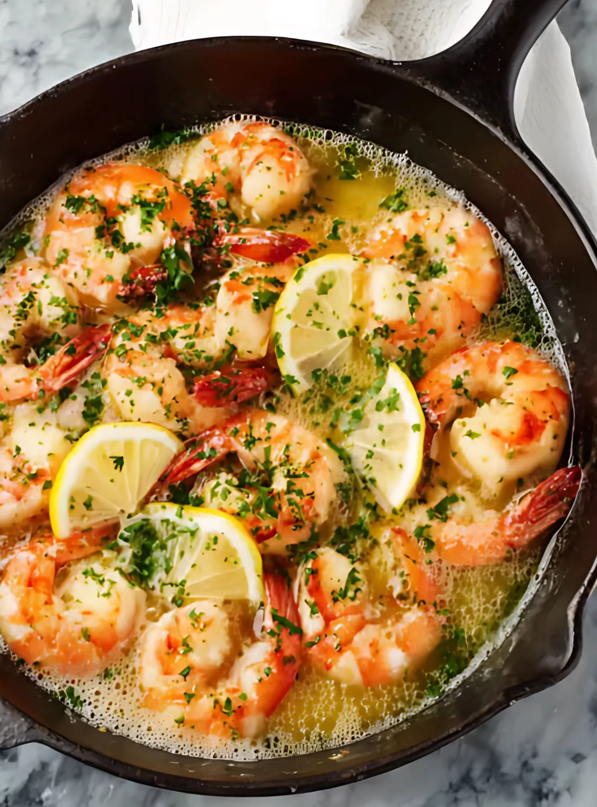 shrimp with lemon in bubbling sauce