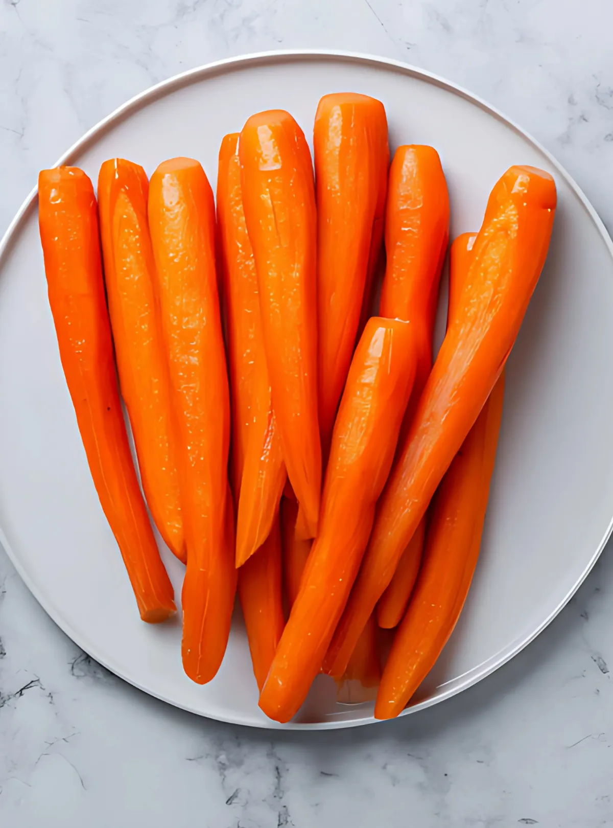steamed carrots on white plate