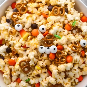Bowl of Halloween popcorn mix with candy eyes