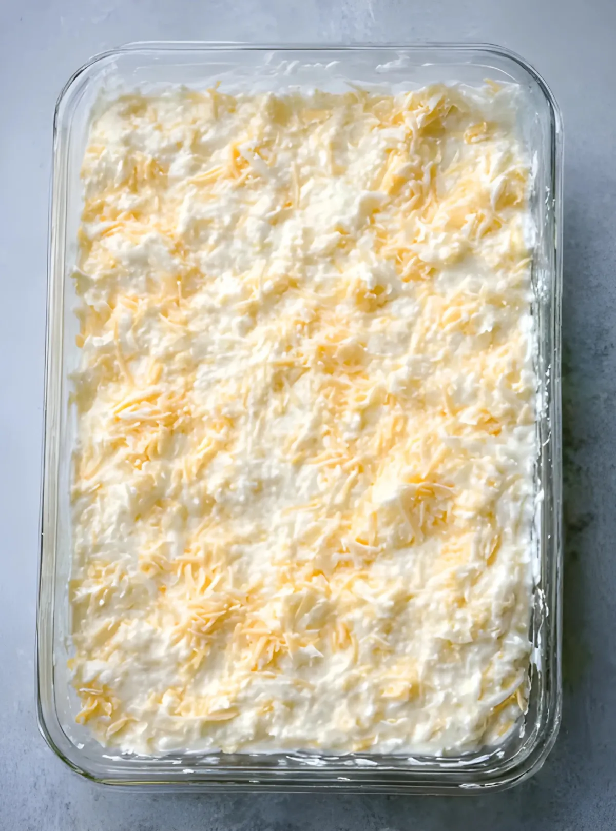 Casserole mixture spread in glass dish