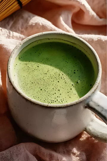 Ceramic mug of creamy matcha latte