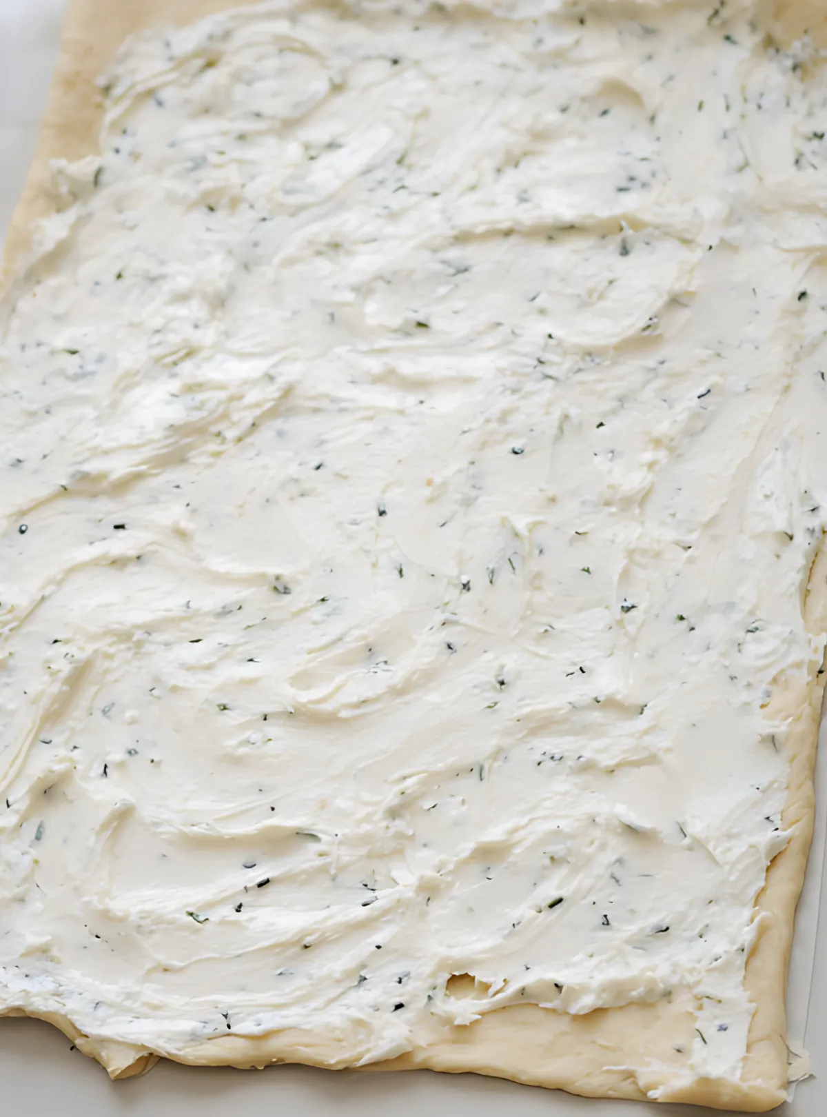 Dough spread with herbed cream cheese