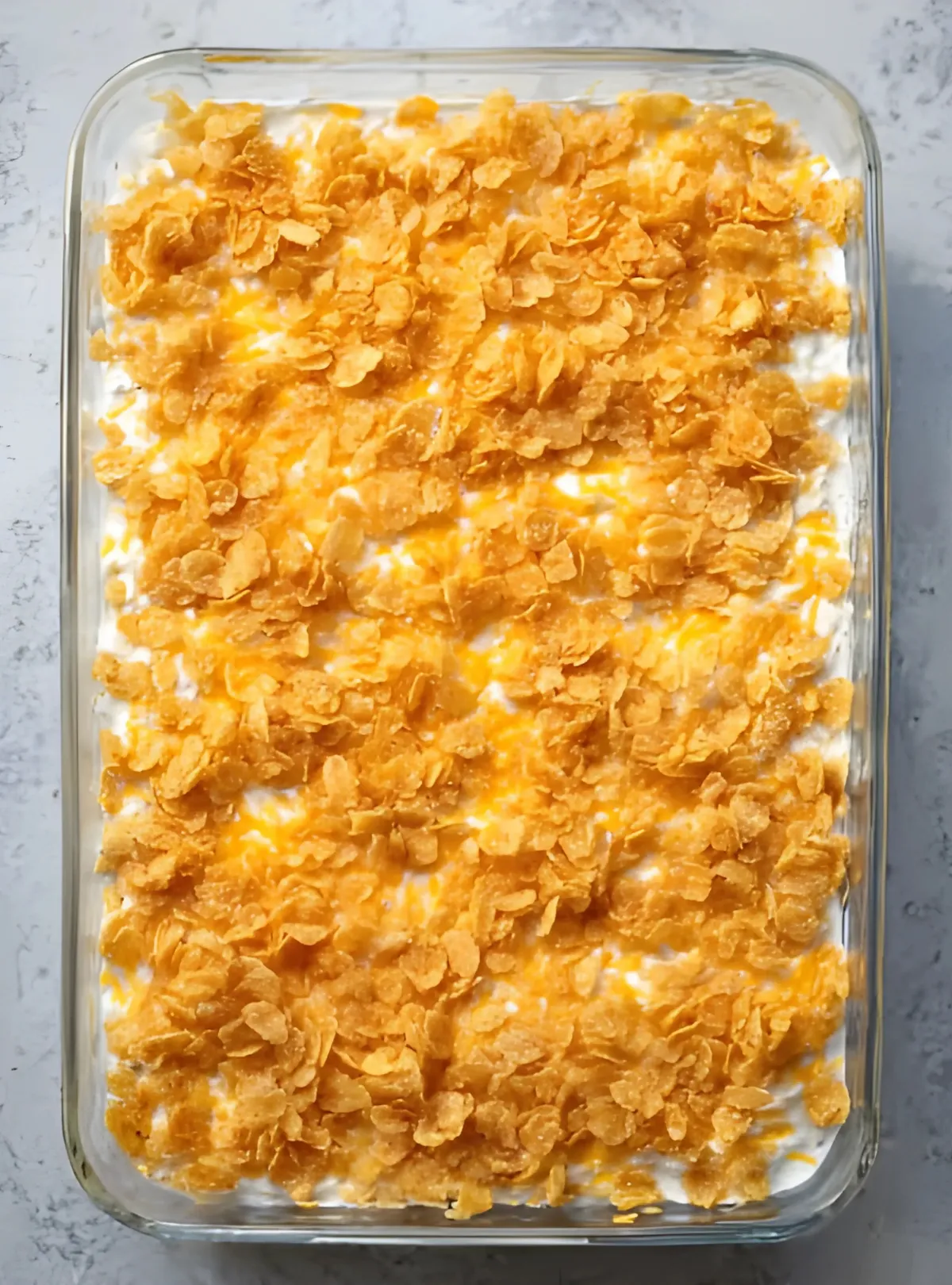 Unbaked casserole topped with cornflakes