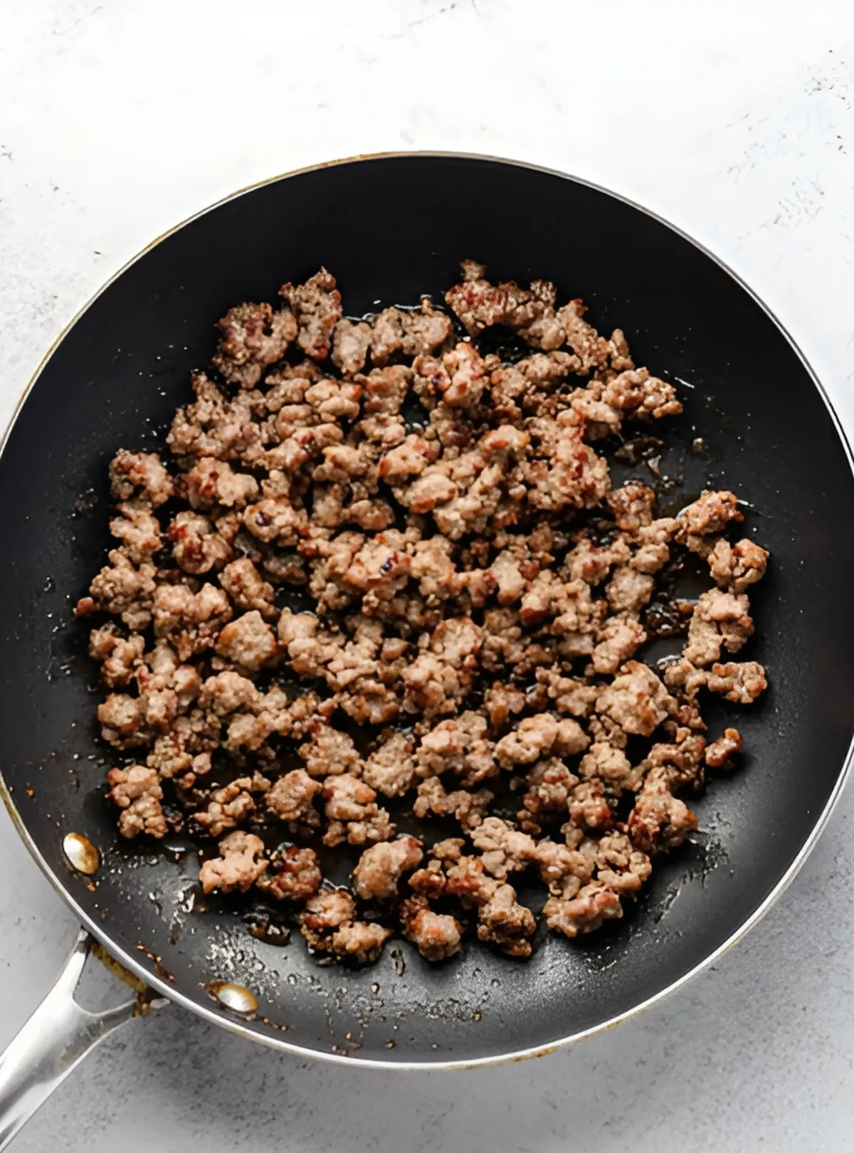 browned sausage in skillet