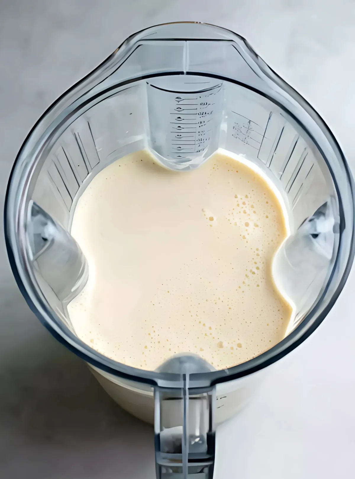 crepe batter resting in a blender jar