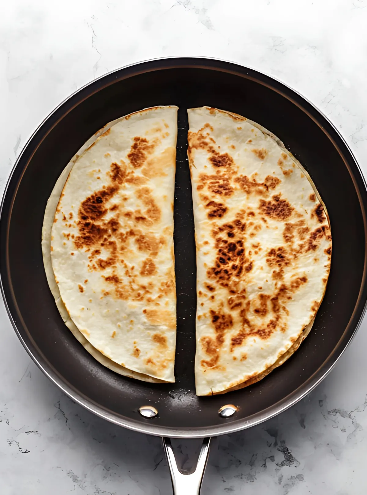 toasted quesadillas in skillet
