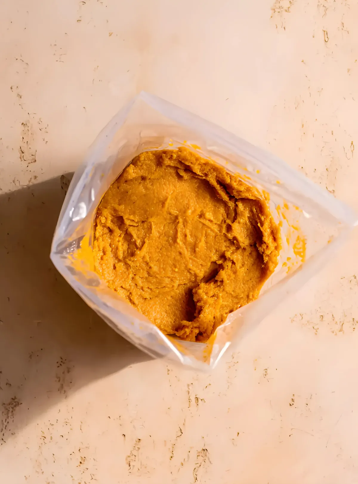 Pumpkin donut batter in piping bag