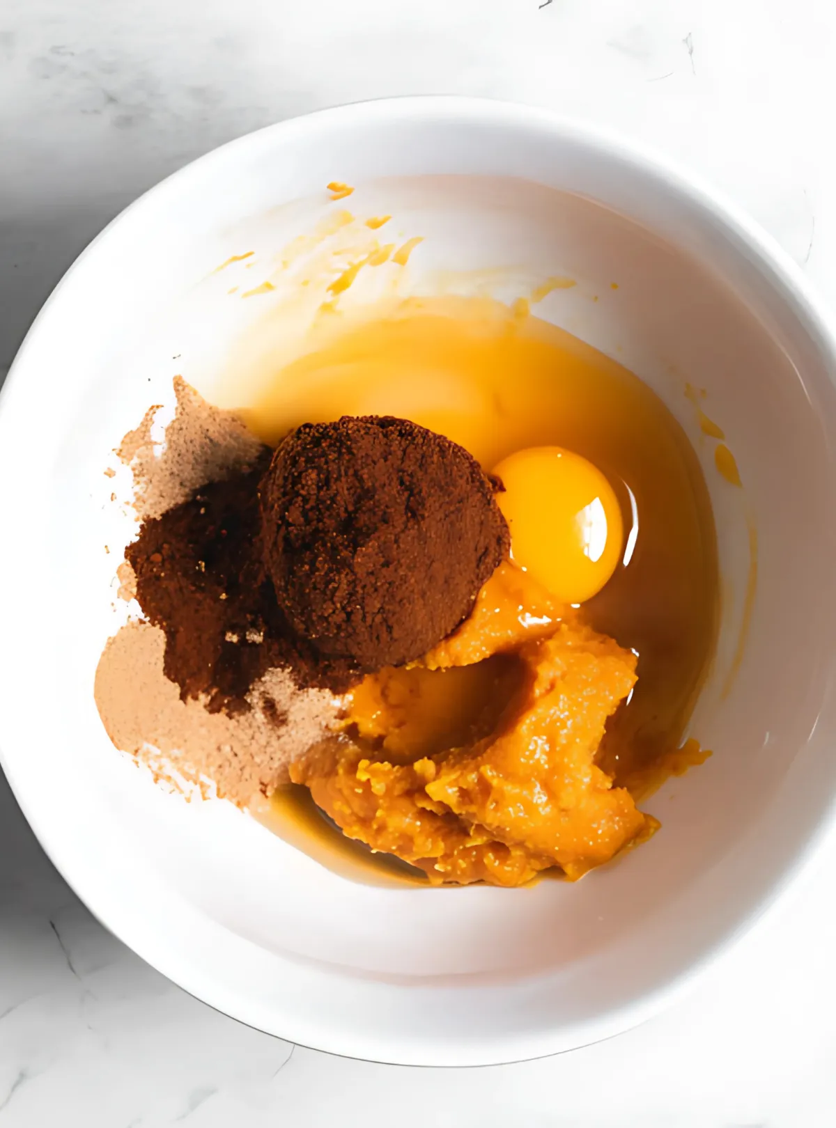 cookie ingredients egg pumpkin sugar in bowl