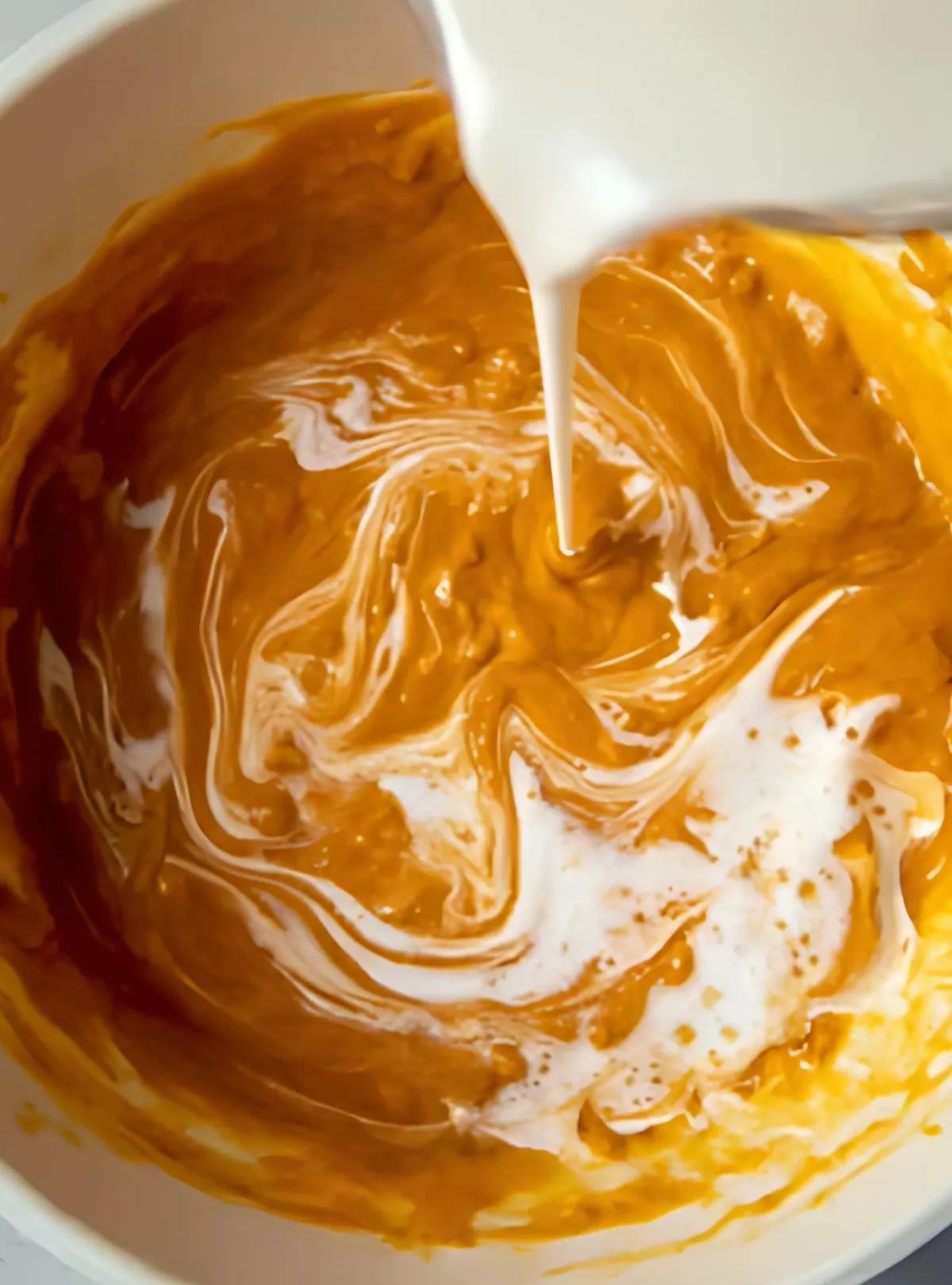 cream pouring pumpkin sauce