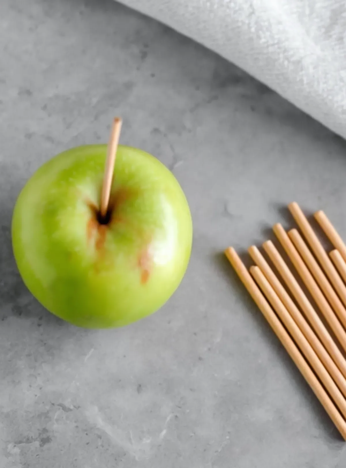 green apple with sticks